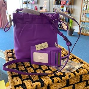 Fossil Gigi style bright purple and small wallet. So much space in a tiny bag